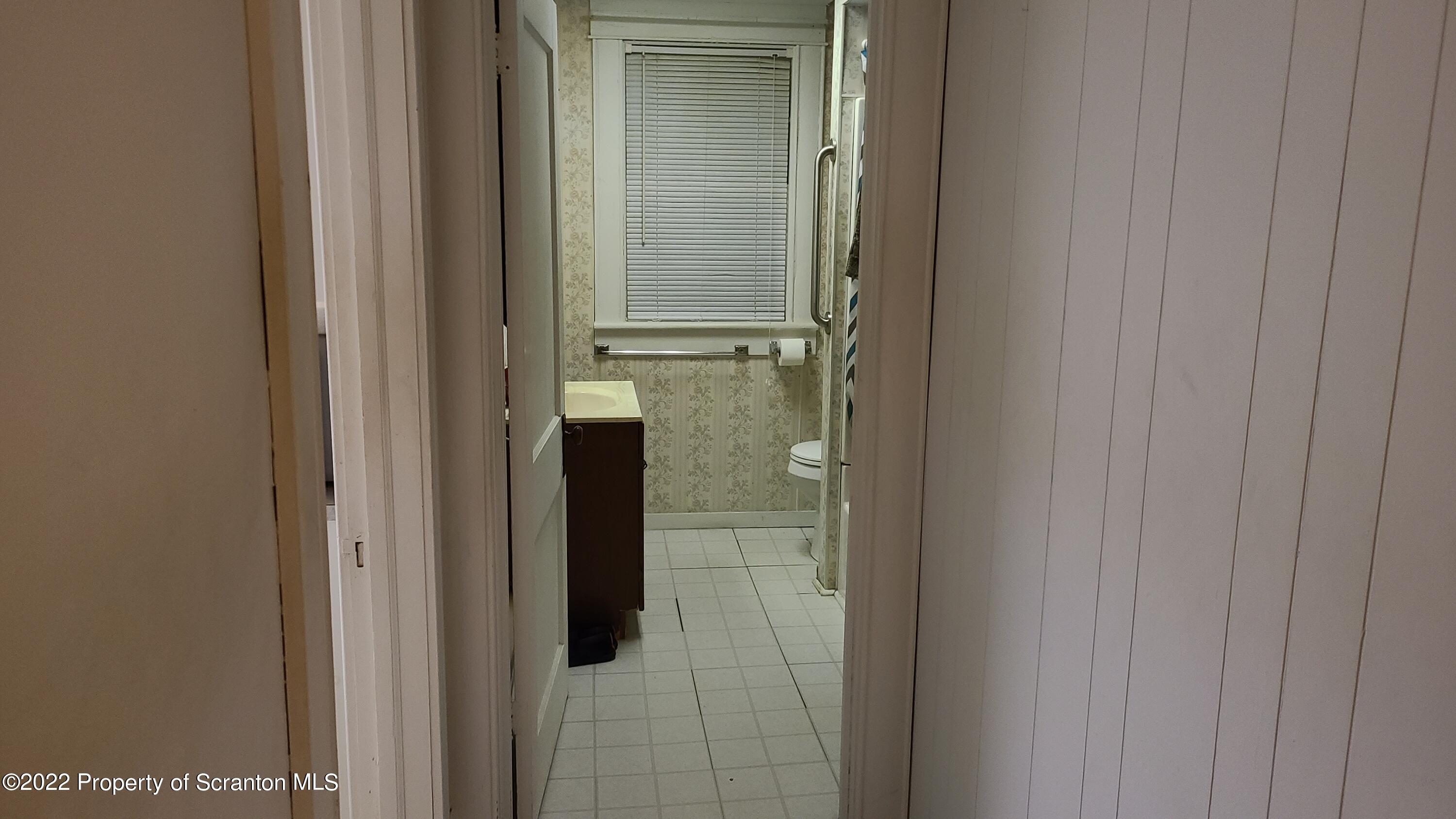 418 North Main Street Simpson, PA 18407 - Photo 14 of 19 a bathroom with a glass door shower