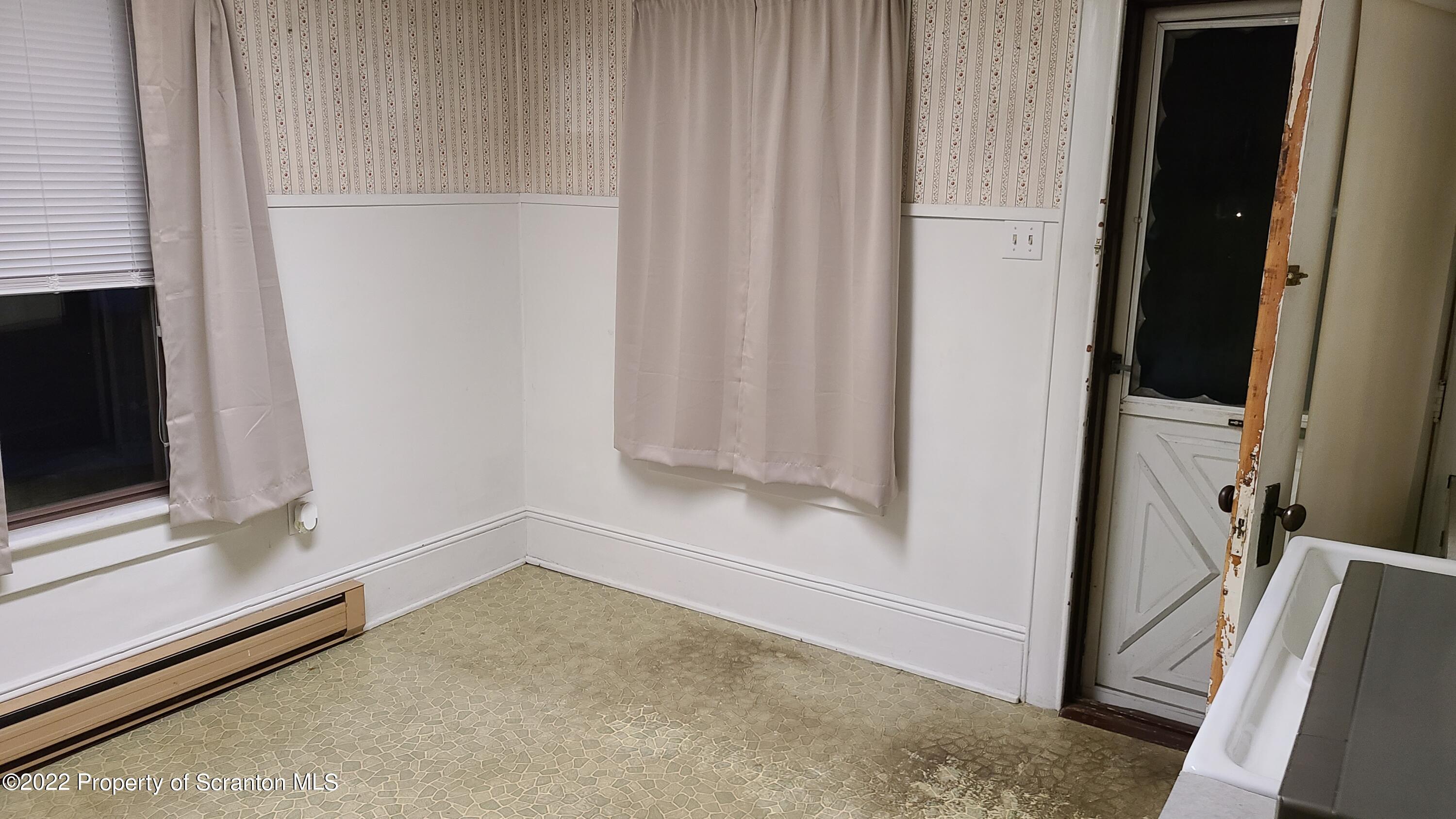 418 North Main Street Simpson, PA 18407 - Photo 15 of 19 a view of an empty room with a fireplace