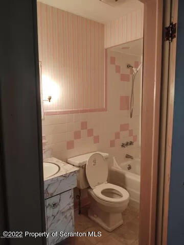 418 North Main Street Simpson, PA 18407 - Photo 9 of 19 a white toilet sitting next to a bathroom sink