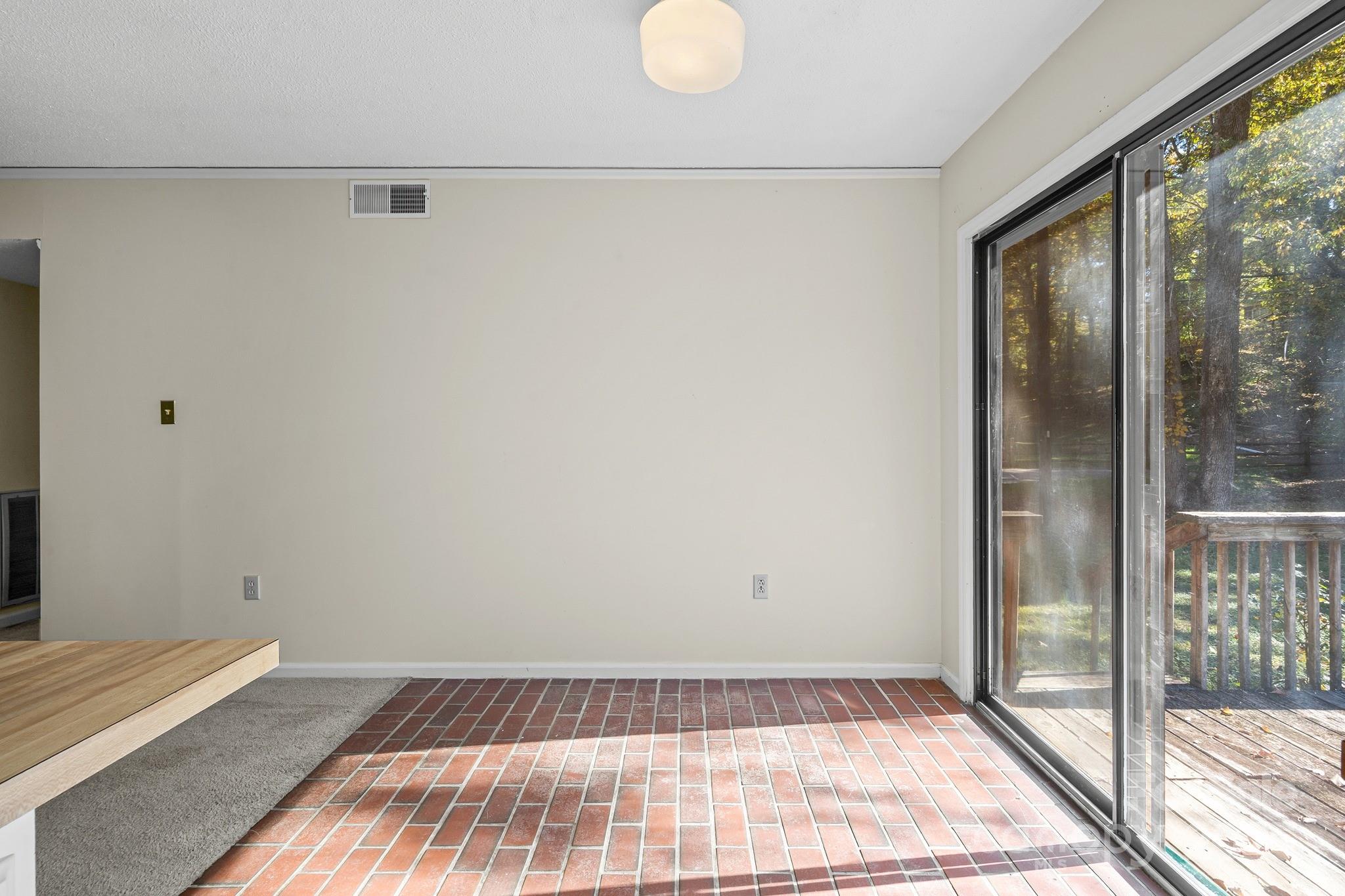 331 Meadowbrook Road Charlotte, NC 28211 - Photo 11 of 32 a view of a room with wooden floor and glass door