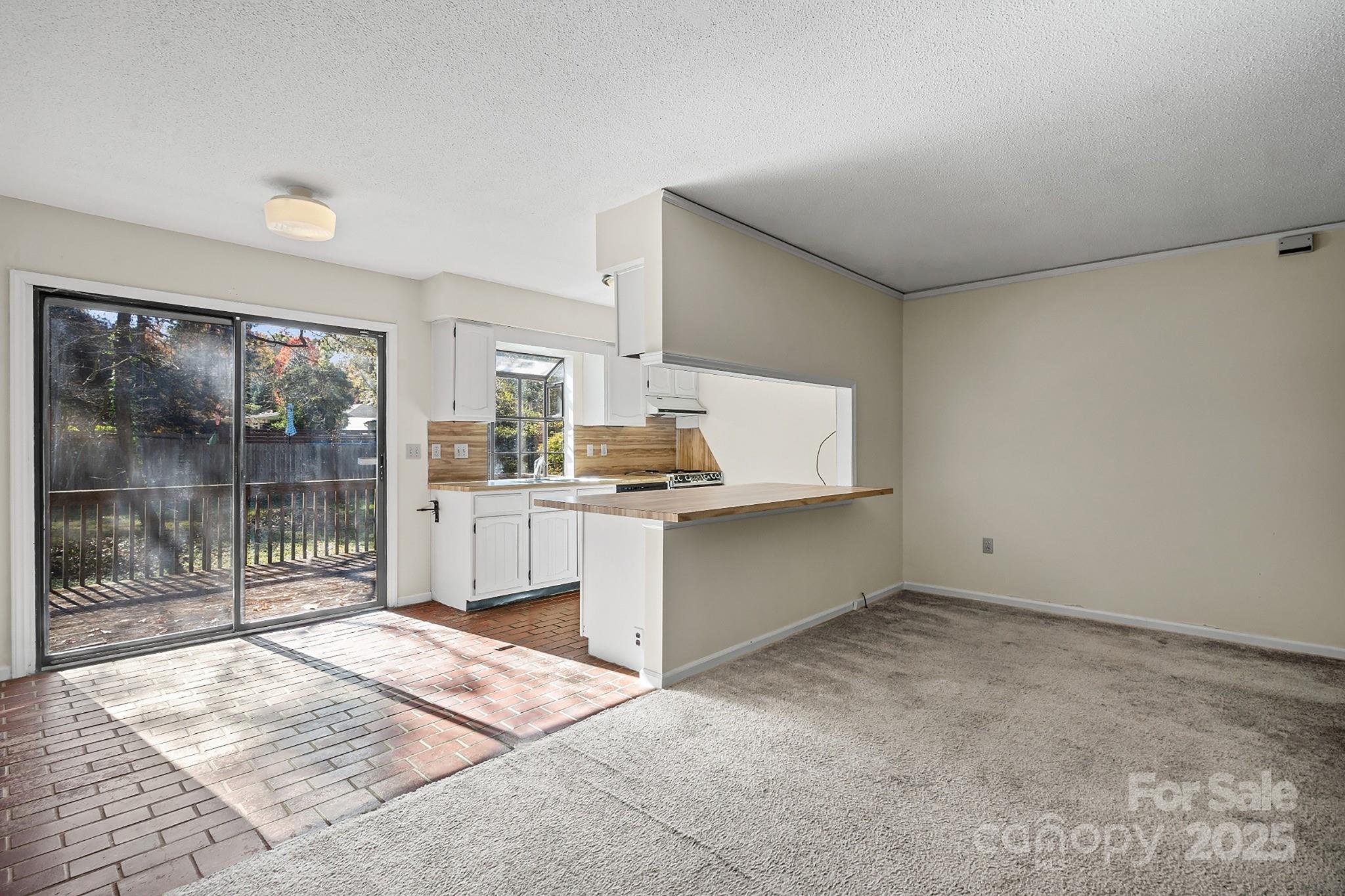 331 Meadowbrook Road Charlotte, NC 28211 - Photo 7 of 32 a kitchen with a refrigerator and window