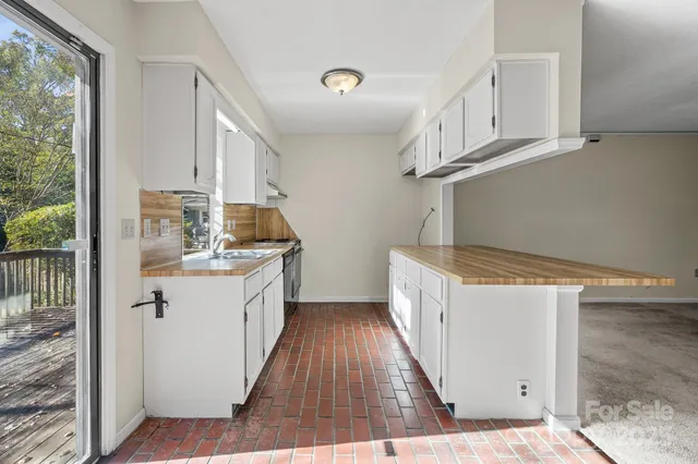 a kitchen with sink a cabinets and window