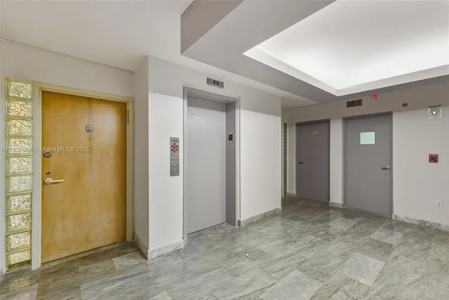 an empty room with closet area