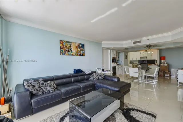 a living room with furniture and a rug
