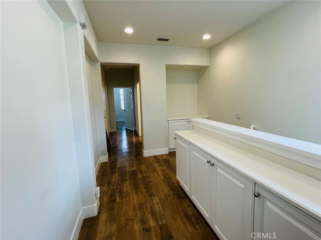 173 Sanctuary Irvine, CA 92620 - Photo 17 of 24 a view of hallway with wooden floor