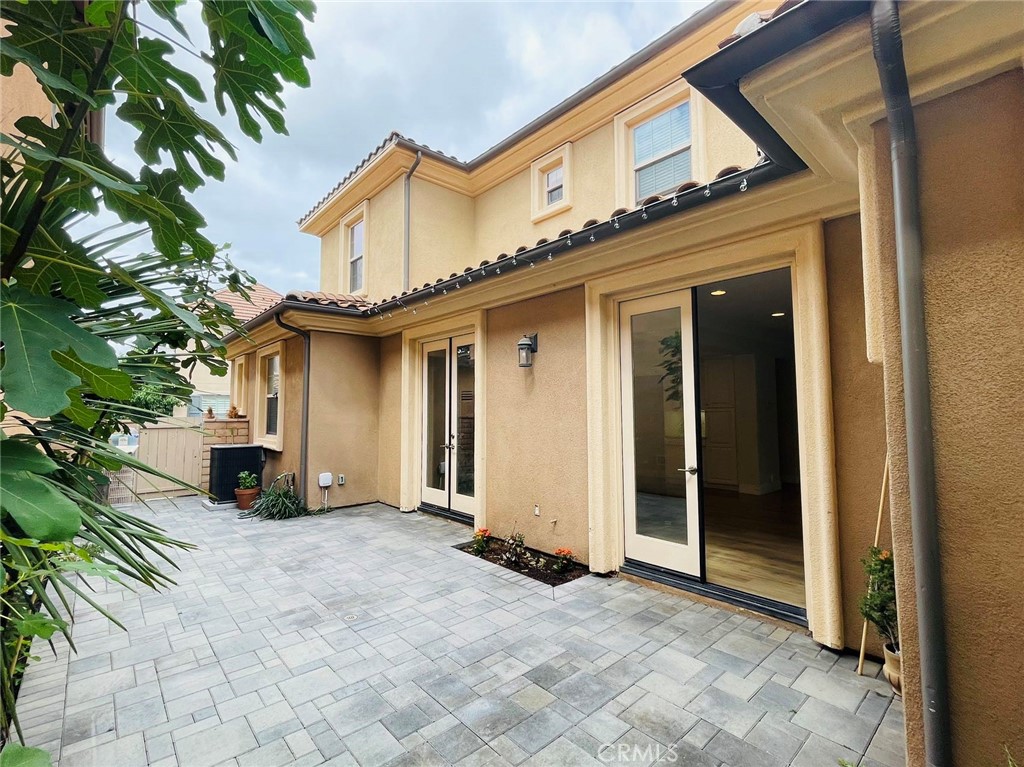 173 Sanctuary Irvine, CA 92620 - Photo 23 of 24 a view of a house with a big yard and large tree