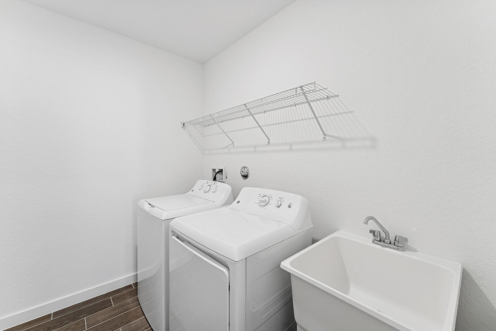 9740 Apollo Avenue, Unit 2 Fort Pierce, FL 34945 - Photo 14 of 18 a utility room with dryer and washer