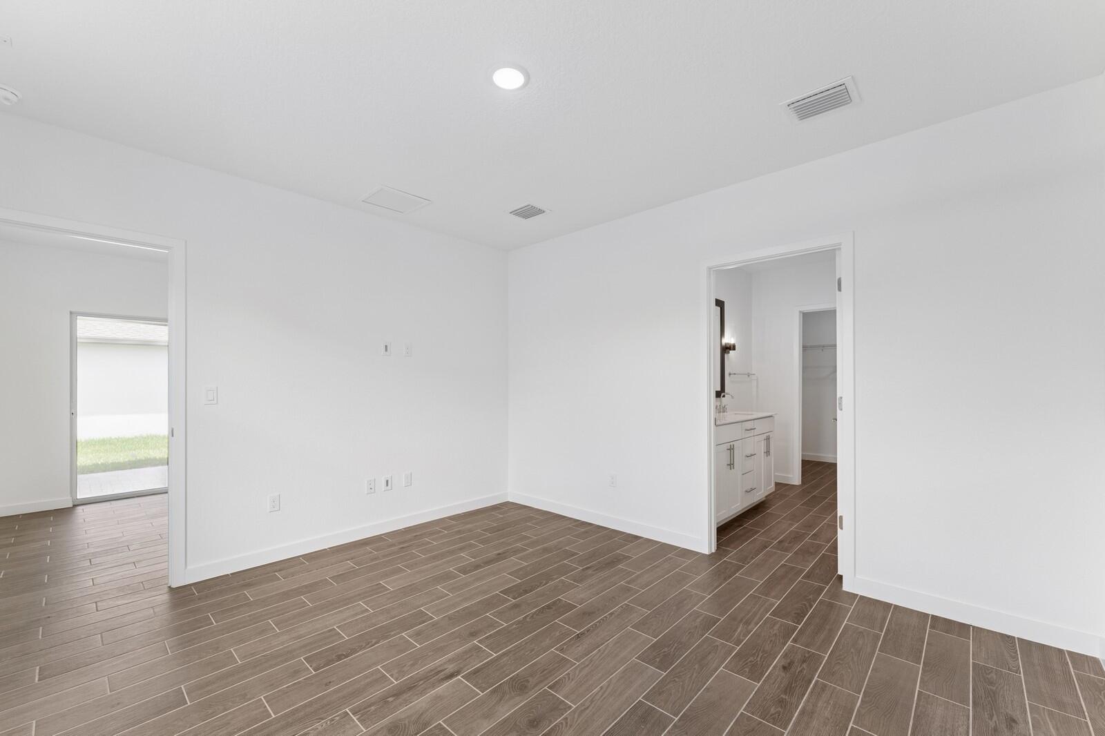9740 Apollo Avenue, Unit 2 Fort Pierce, FL 34945 - Photo 8 of 18 a view of a room with wooden floor and a sink