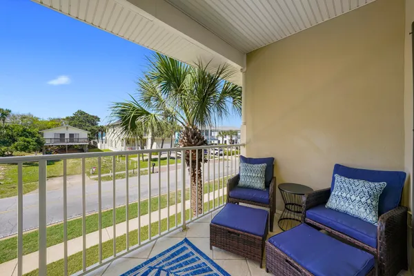 a view of a balcony with chairs