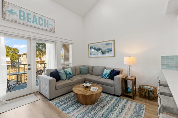 a living room with furniture and a lamp