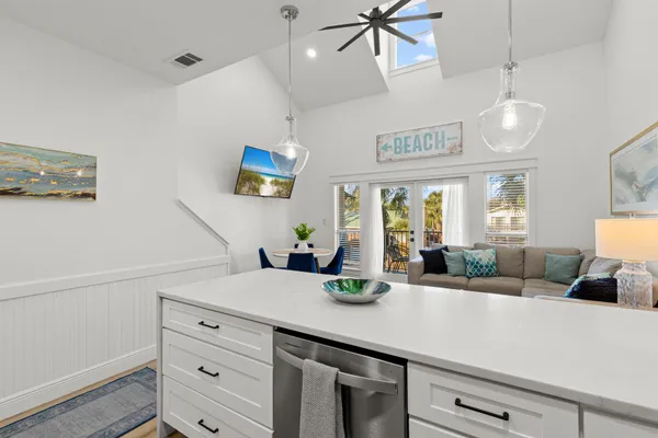 a kitchen with a counter space a window and couch