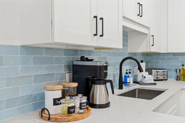 a kitchen with a sink and cabinets