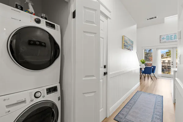a view of a hallway with washer and dryer