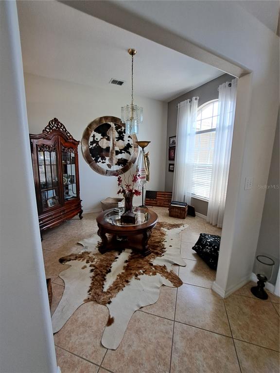 2863 Middleton Circle Kissimmee, FL 34743 - Photo 13 of 43 a living room with a couch and a window