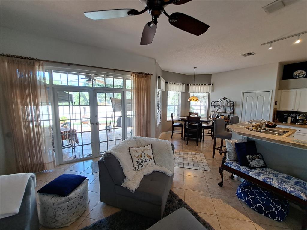 2863 Middleton Circle Kissimmee, FL 34743 - Photo 17 of 43 a living room with furniture and a large window