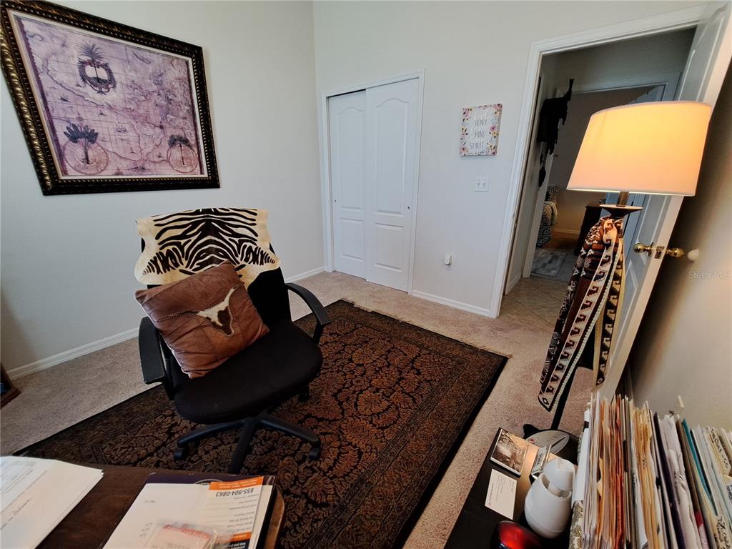 2863 Middleton Circle Kissimmee, FL 34743 - Photo 18 of 43 a living room with furniture and a flat screen tv