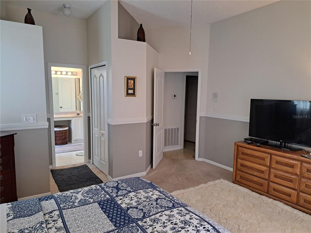 2863 Middleton Circle Kissimmee, FL 34743 - Photo 22 of 43 a living room with furniture and a flat screen tv