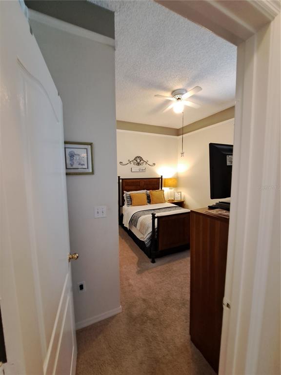 2863 Middleton Circle Kissimmee, FL 34743 - Photo 23 of 43 a bedroom with a bed and a television