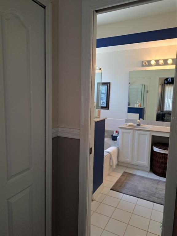 2863 Middleton Circle Kissimmee, FL 34743 - Photo 25 of 43 a bathroom with a sink a toilet and mirror