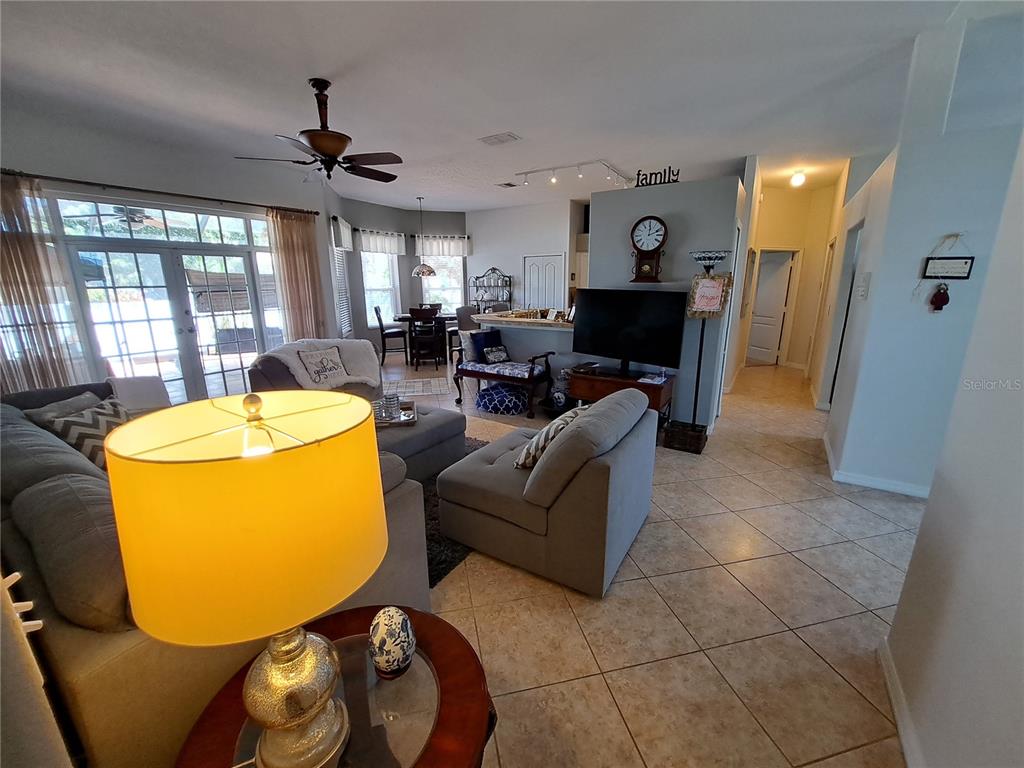 2863 Middleton Circle Kissimmee, FL 34743 - Photo 31 of 43 a living room with furniture and a fireplace