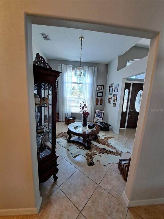 2863 Middleton Circle Kissimmee, FL 34743 - Photo 33 of 43 a living room with furniture a window and gym equipment