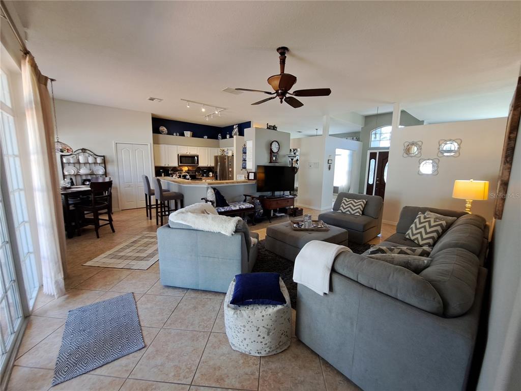 2863 Middleton Circle Kissimmee, FL 34743 - Photo 39 of 43 a living room with furniture and a ceiling fan