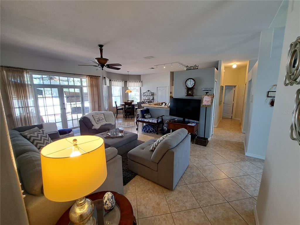 2863 Middleton Circle Kissimmee, FL 34743 - Photo 40 of 43 a living room with fireplace furniture and a large window