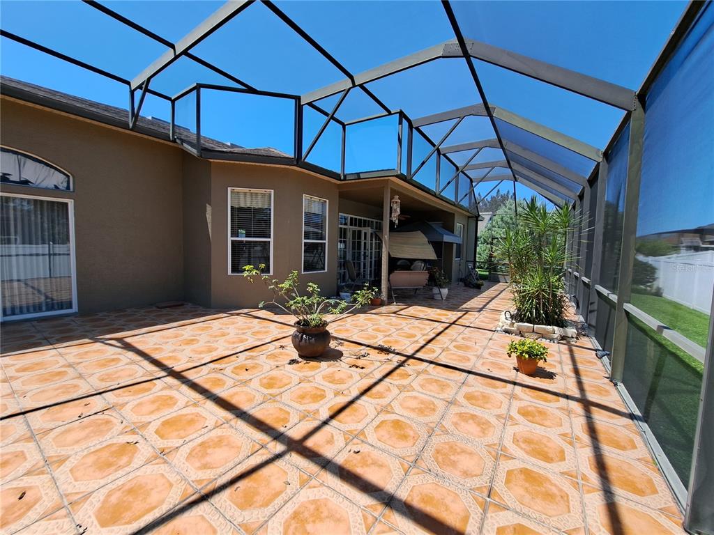 2863 Middleton Circle Kissimmee, FL 34743 - Photo 6 of 43 a view of house with backyard and glass door