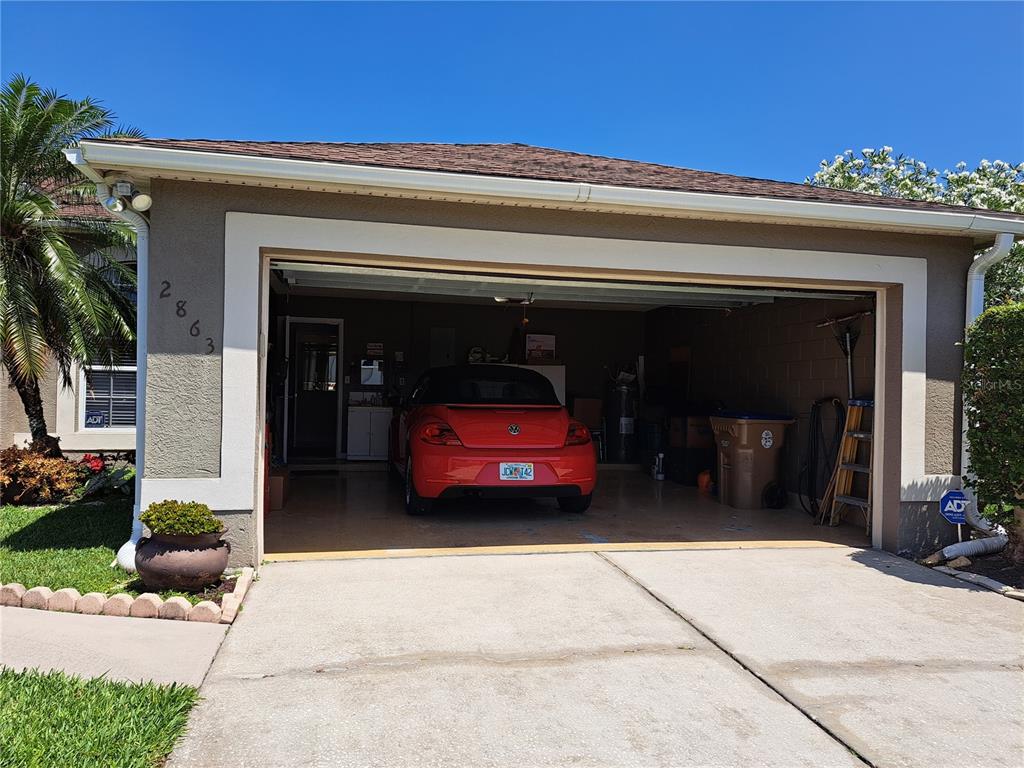 2863 Middleton Circle Kissimmee, FL 34743 - Photo 10 of 43 a front view of a house with a garage