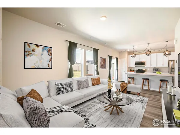 a living room with furniture and a table