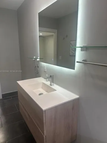 a bathroom with a sink and a mirror