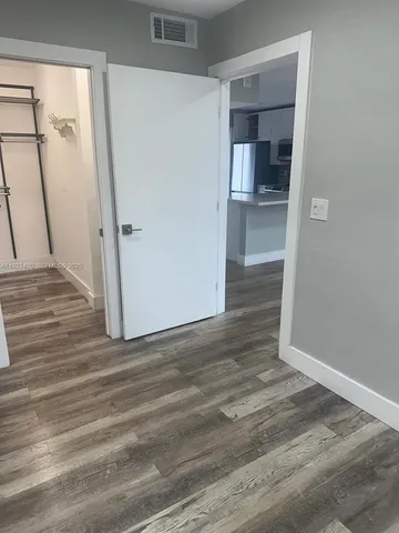 a view of a hardwood & utility room