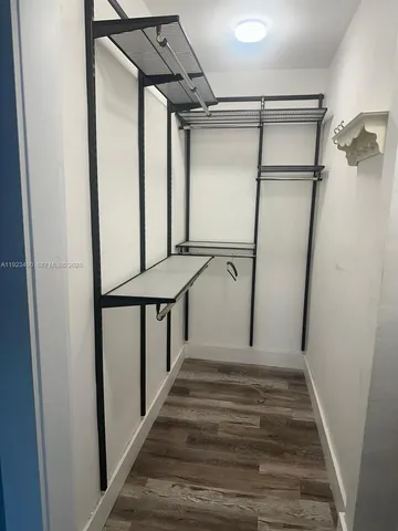 a view of a kitchen with sink and cabinet