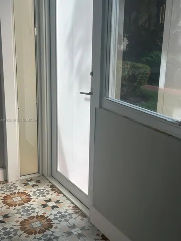 closeup of a sink with wooden floor
