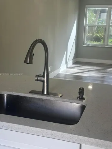 a view of a street with a cars park