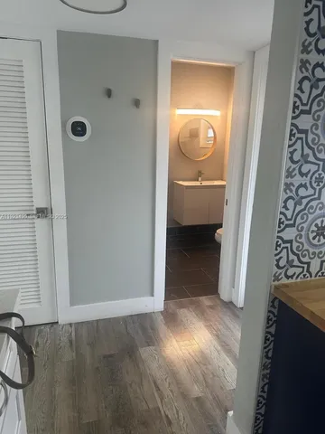 a view of a bathroom from a hallway