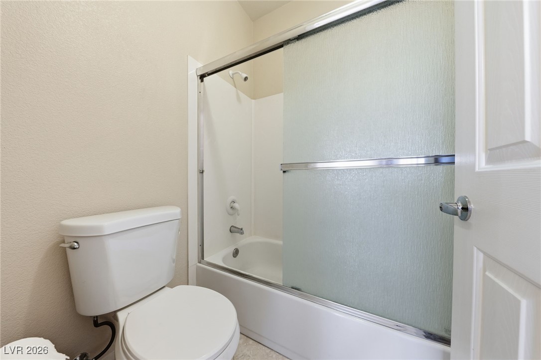 3766 Port Ritchey Street Las Vegas, NV 89147 - Photo 23 of 50 Full bathroom with combined bath / shower with glass door and a textured wall