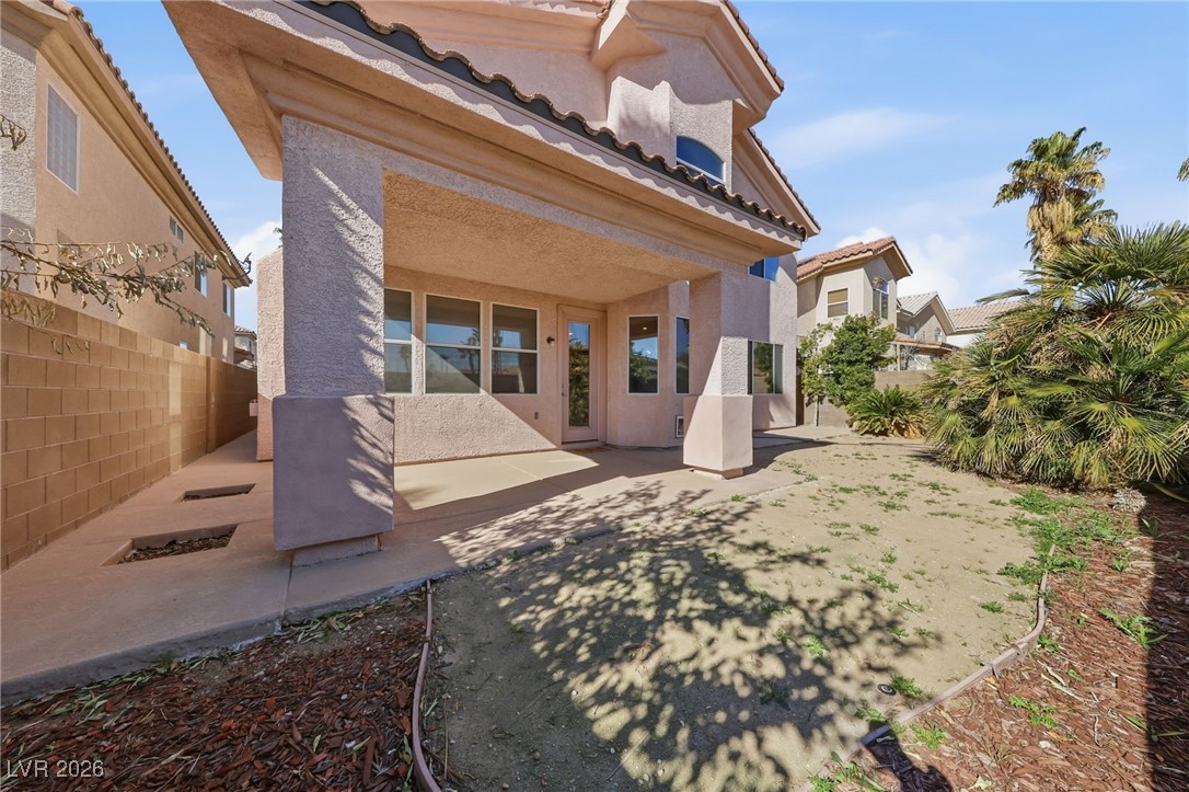 3766 Port Ritchey Street Las Vegas, NV 89147 - Photo 46 of 50 Back of property featuring stucco siding and a patio