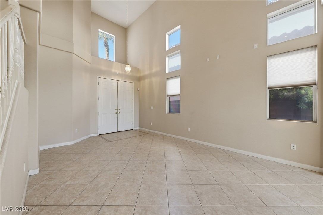 3766 Port Ritchey Street Las Vegas, NV 89147 - Photo 5 of 50 Entrance foyer with a high ceiling and light tile patterned floors