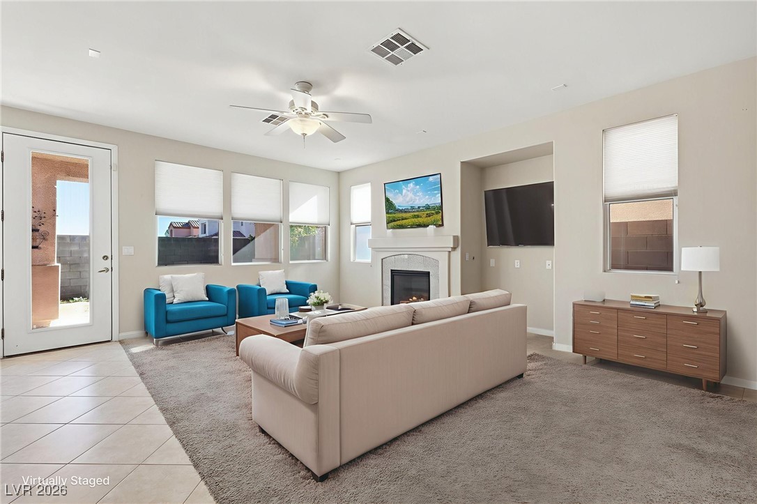 3766 Port Ritchey Street Las Vegas, NV 89147 - Photo 8 of 50 Family Room Virtually Staged featuring Ceiling Fans and Plenty of Natural Light.