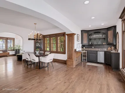 a open kitchen with stainless steel appliances granite countertop a stove and a refrigerator