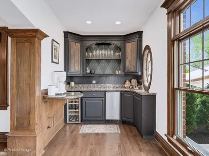 a kitchen with stainless steel appliances granite countertop a stove and a refrigerator