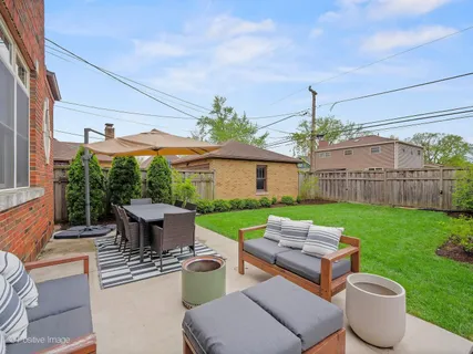 a view of a patio with couches chairs and a table and chairs