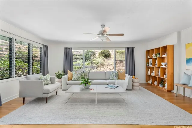 a living room with furniture and a large window