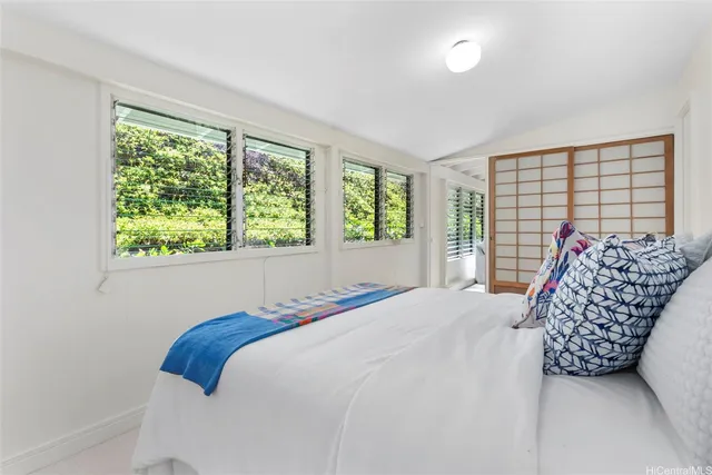 a living room with furniture and a chair