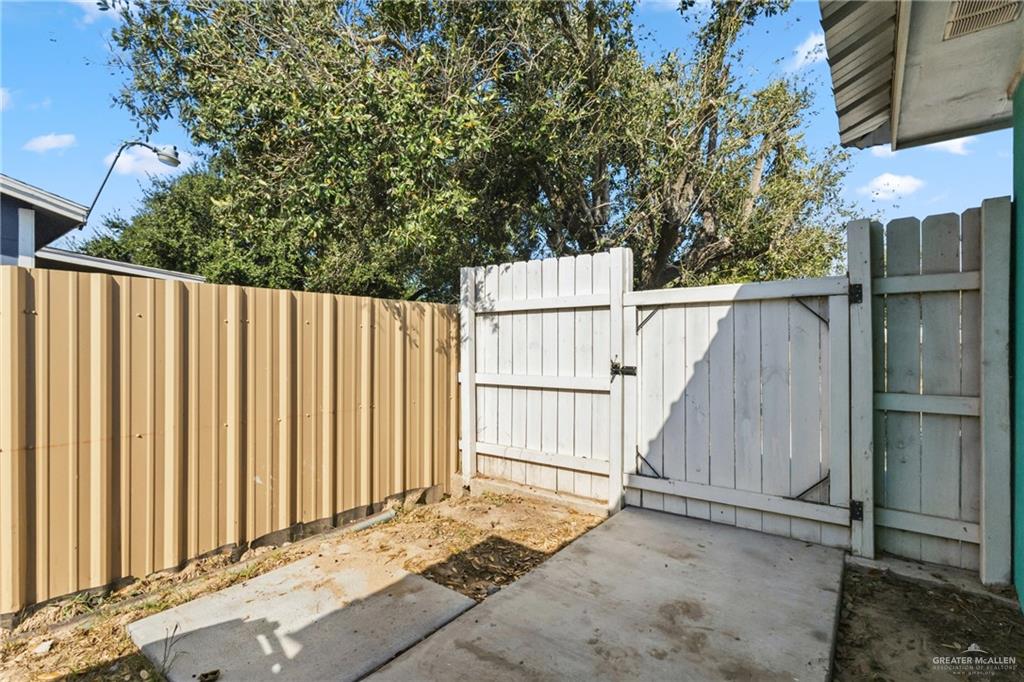 109 Ash Street, Unit B Donna, TX 78537 - Photo 11 of 14 a view of a wooden fence