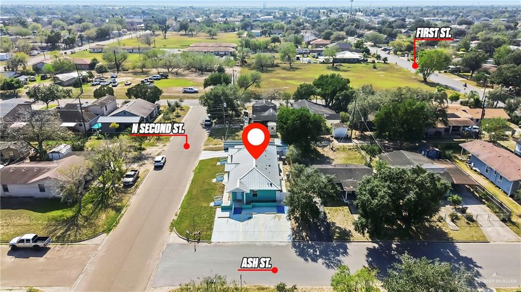 109 Ash Street, Unit B Donna, TX 78537 - Photo 12 of 14 an aerial view of residential houses with outdoor space