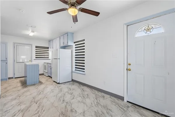 a view of a kitchen with a sink and dishwasher