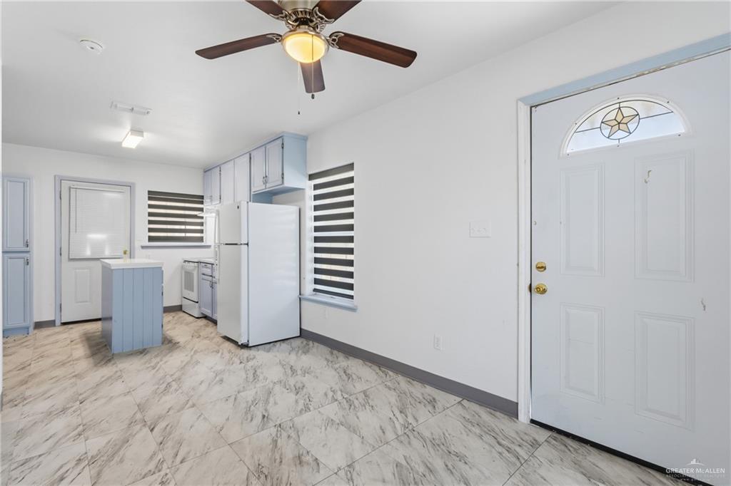 109 Ash Street, Unit B Donna, TX 78537 - Photo 3 of 14 a view of a kitchen with a sink and dishwasher