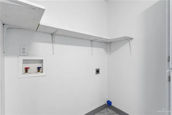 a room with a white cabinet and a white wall